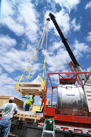 A crane lowers the MRI into place.